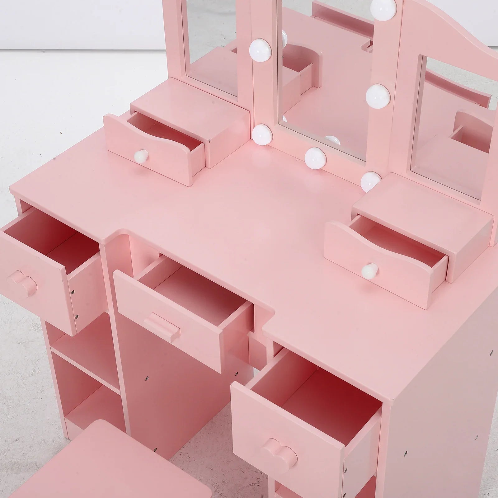 Coiffeuse enfant Hollywood à ampoules rose avec ses tiroirs ouverts